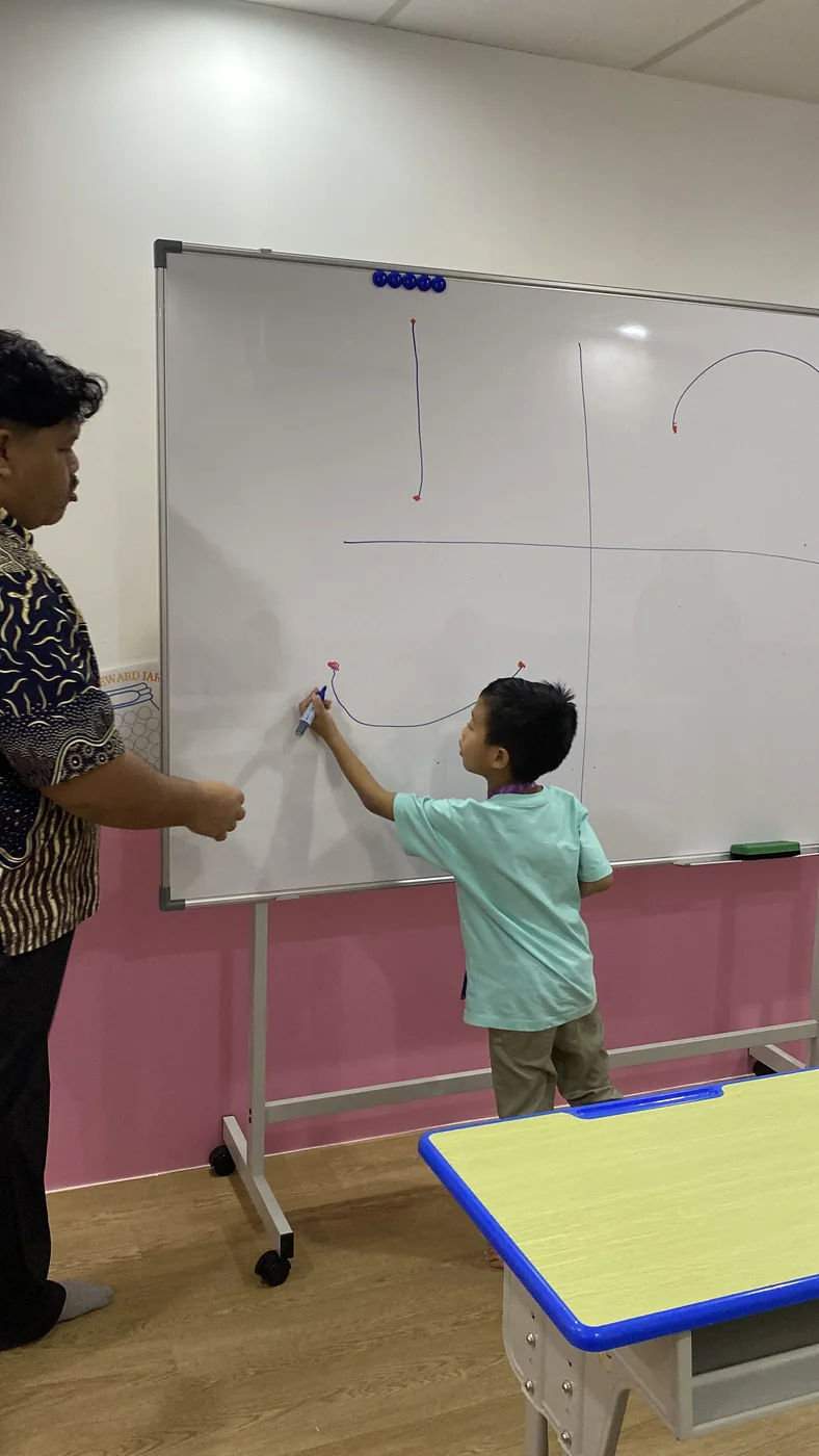 A learner participating in a guided whiteboard activity